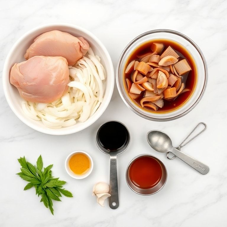 Overhead flat lay of raw boneless chicken thighs, sliced onions, garlic, soy sauce, olive oil, and other marinating ingredients displayed with measuring spoons on a white marble countertop.