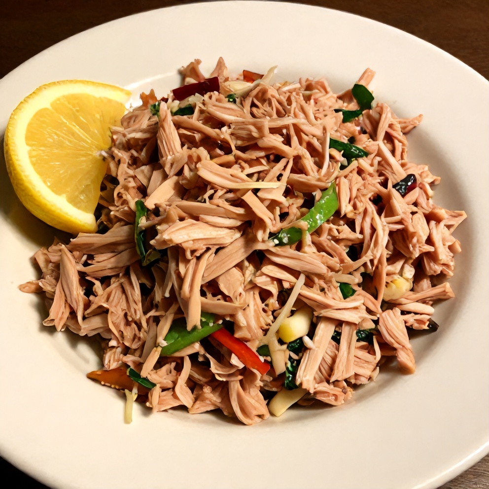 Plated Mediterranean Tuna Salad with lemon wedge
