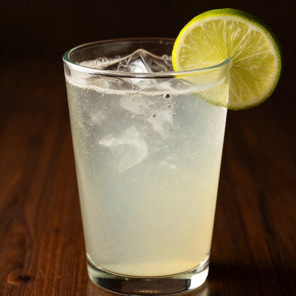 Glass of keto hibiscus lime sparkling water with lime wheel garnish