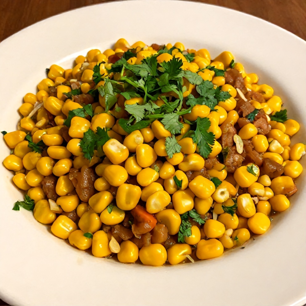 Plated serving of Easy Chipotle Corn Salsa on a white plate, garnished with fresh cilantro, warm side lighting