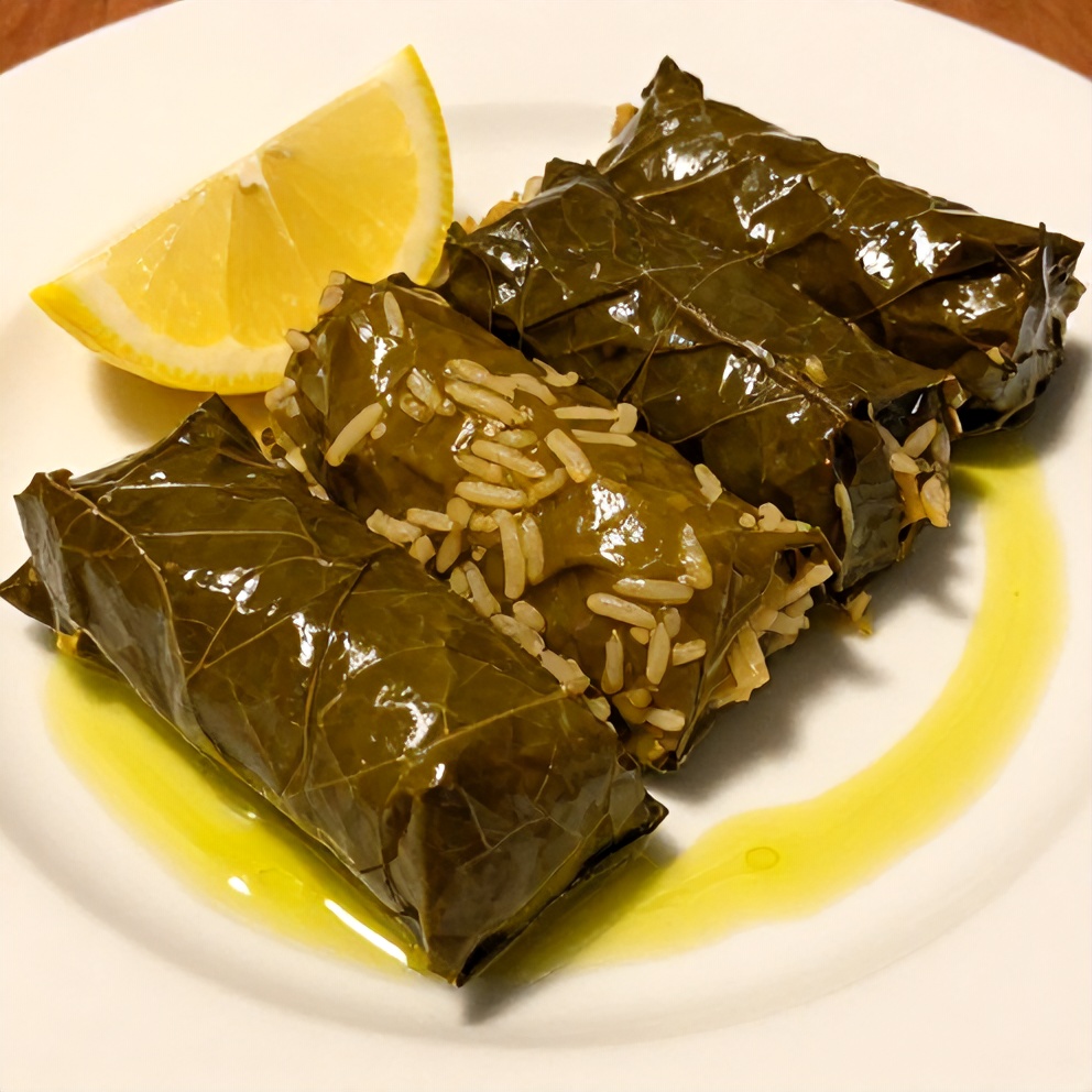 Plated serving of stuffed grape leaves