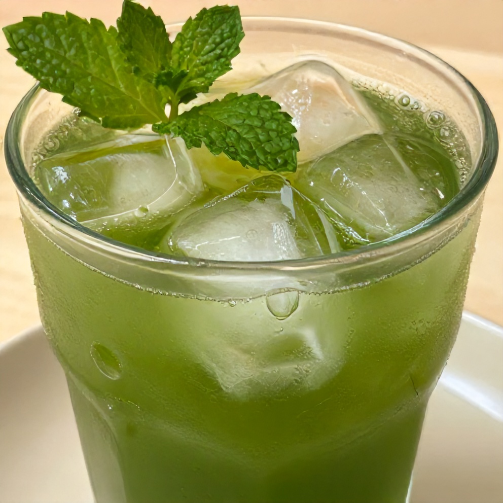 Glass of iced green tea with ice cubes